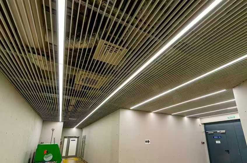 Straight recessed LED linear lights in airport service corridor
