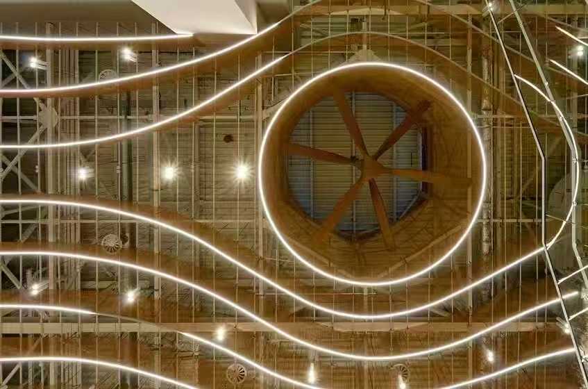 Circular LED ring light feature in airport ceiling