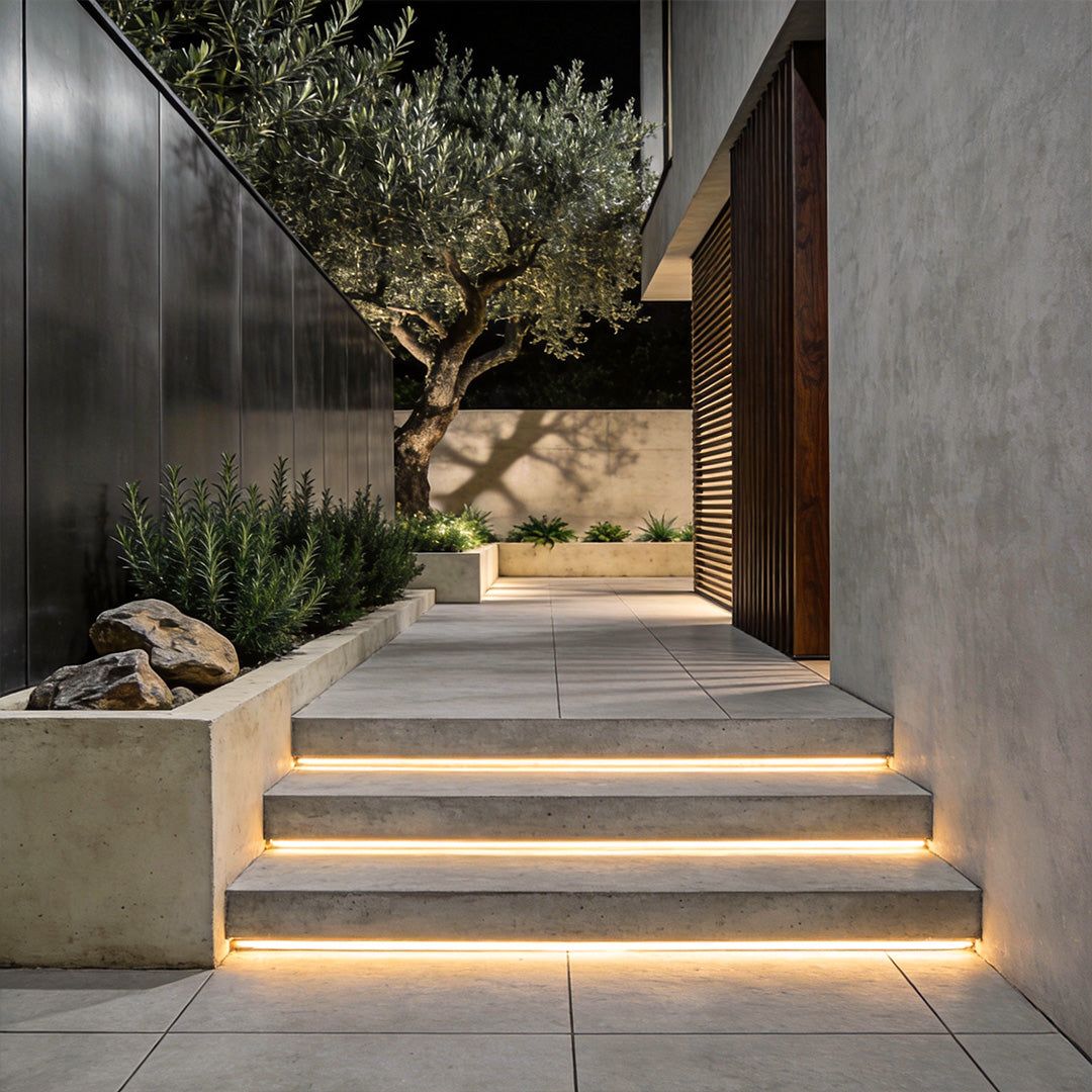 Warm LED strip lights embedded in modern garden steps and pathway