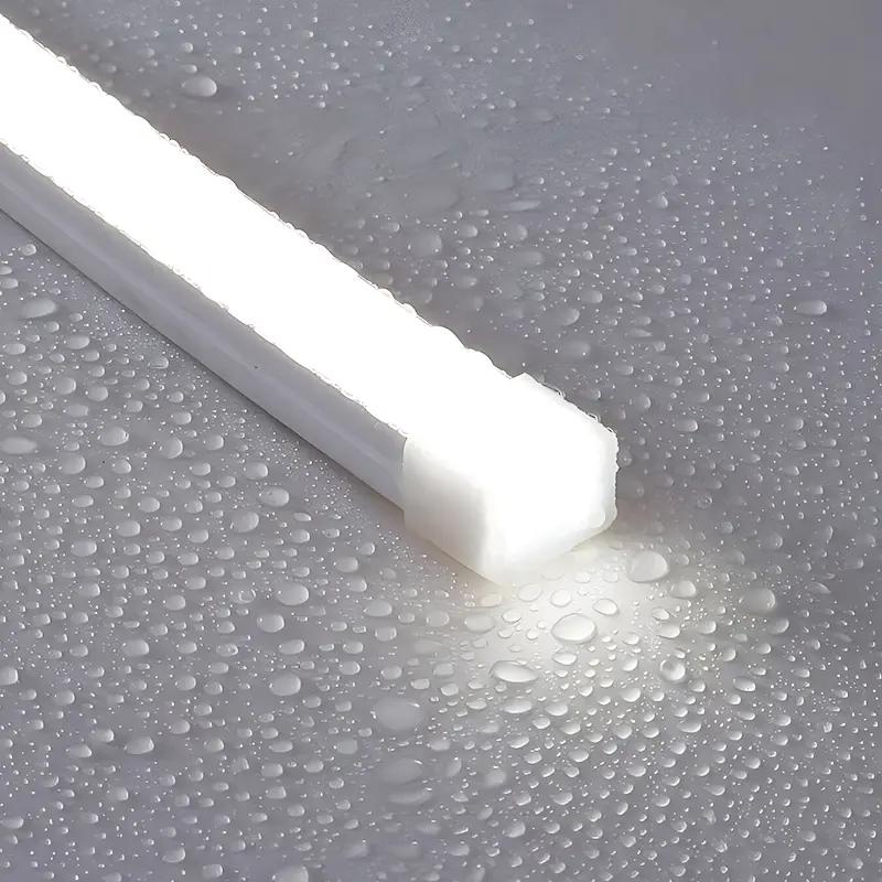 Solid silicone encapsulated IP68 LED strip light on wet surface with water droplets