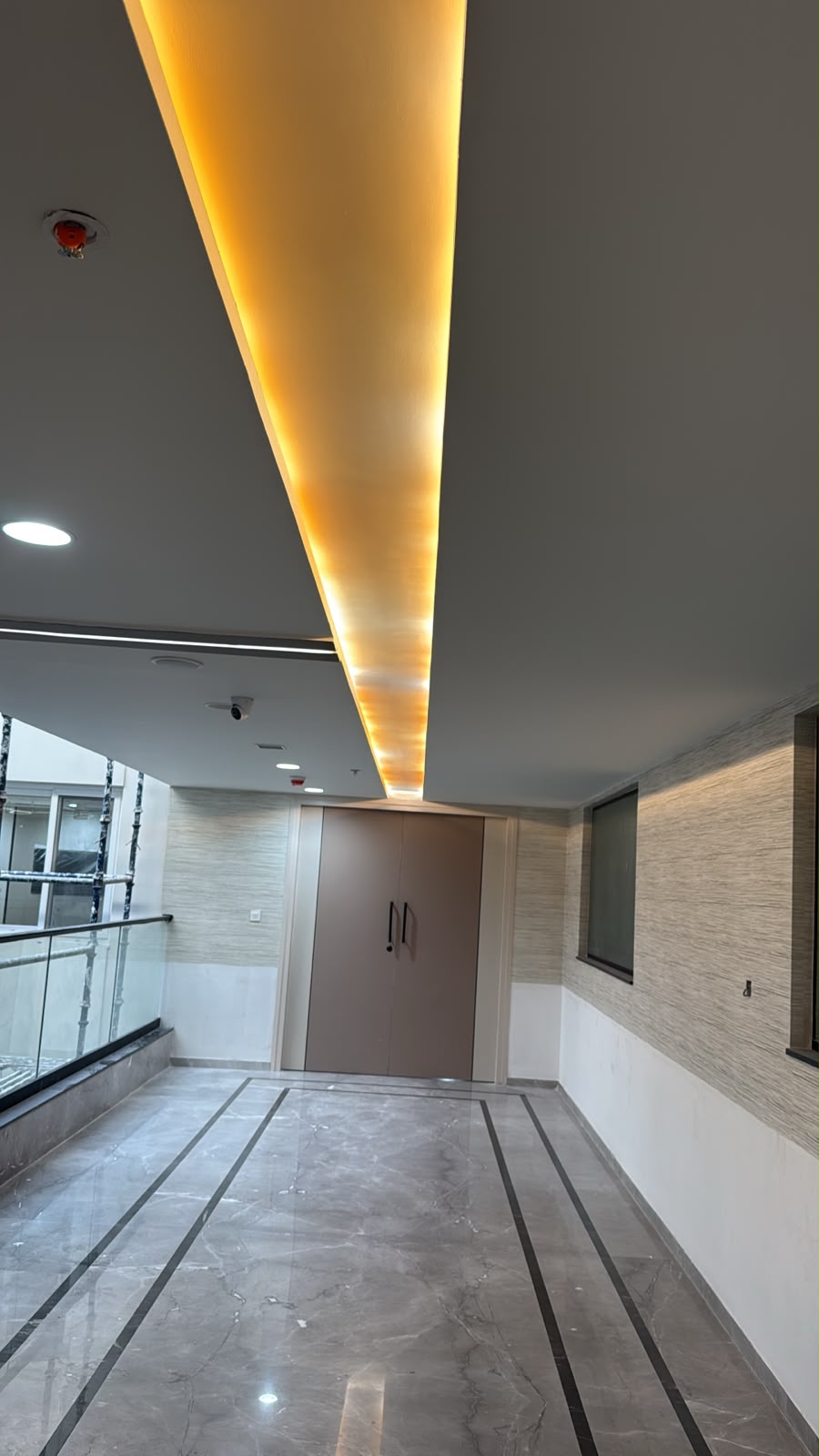 Completed corridor with recessed LED strip lighting